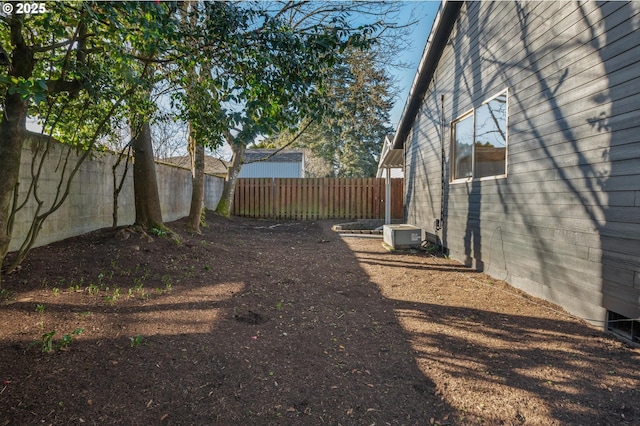 view of yard with a fenced backyard