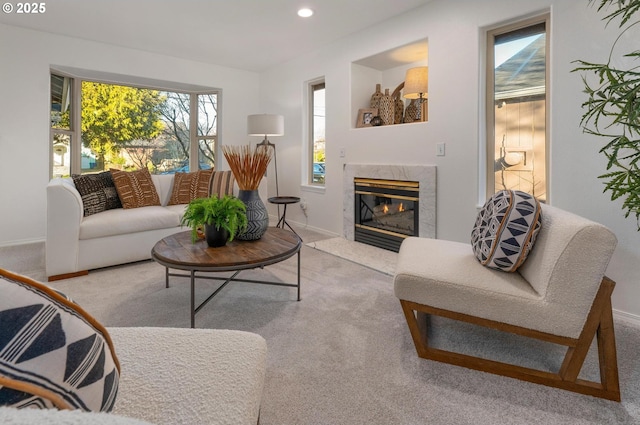 living room with baseboards, a fireplace, carpet flooring, and recessed lighting