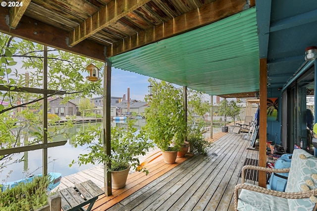 wooden deck with a water view