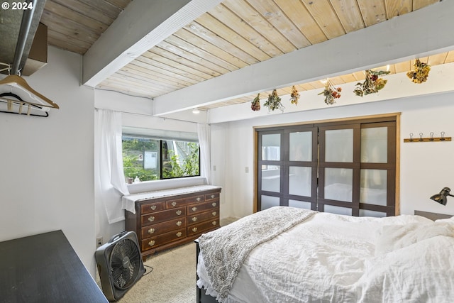 carpeted bedroom with beamed ceiling and wooden ceiling