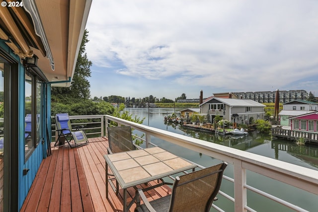 balcony featuring a water view