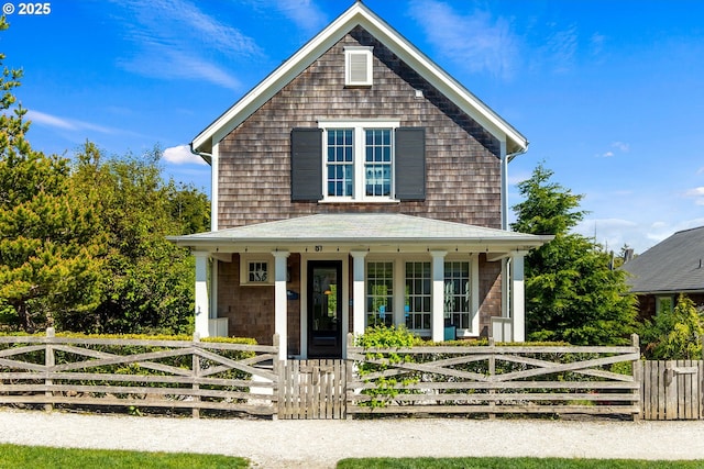view of front of home featuring a porch and a fenced front yard