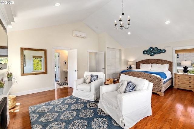 bedroom featuring a chandelier, a wall mounted AC, hardwood / wood-style floors, high vaulted ceiling, and baseboards