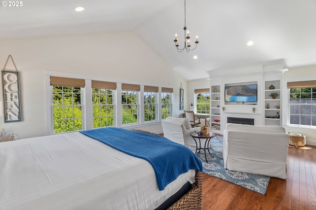 bedroom featuring a chandelier, wood finished floors, high vaulted ceiling, recessed lighting, and a fireplace