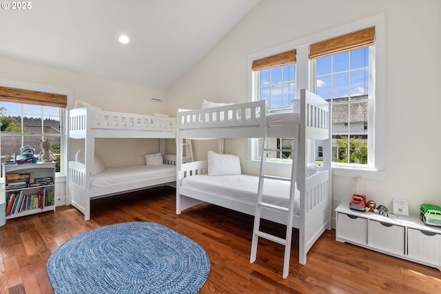 bedroom with lofted ceiling, wood finished floors, and recessed lighting