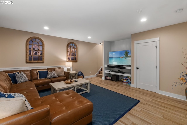 living room featuring stairway, wood finished floors, baseboards, and recessed lighting