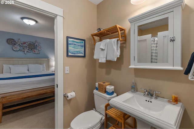 bathroom featuring a sink and toilet