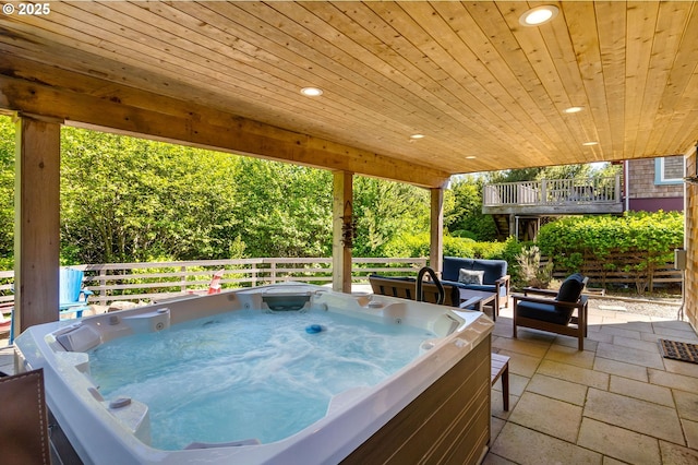 view of patio / terrace featuring a hot tub and outdoor lounge area