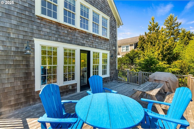 wooden deck with outdoor dining space