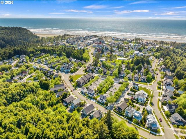 aerial view of residential area featuring a nearby body of water