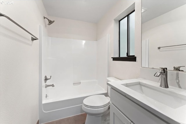 full bathroom featuring vanity, shower / bath combination, and toilet