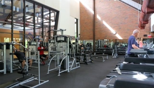 exercise room with brick wall