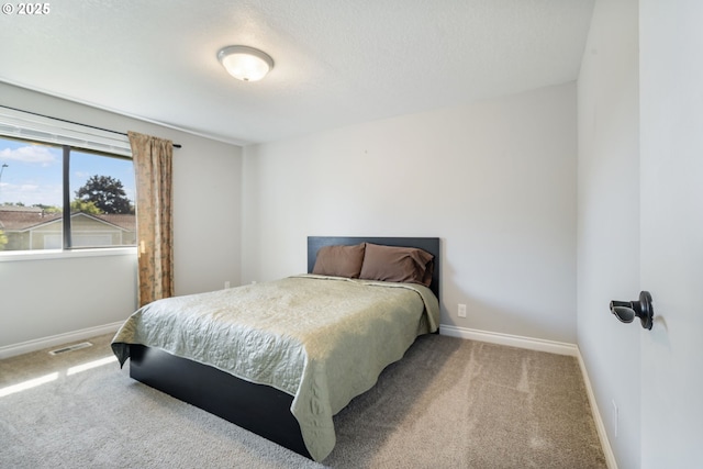 461 NE 16th Ave, Hillsboro, OR 97124 - carpeted bedroom with baseboards and a textured ceiling