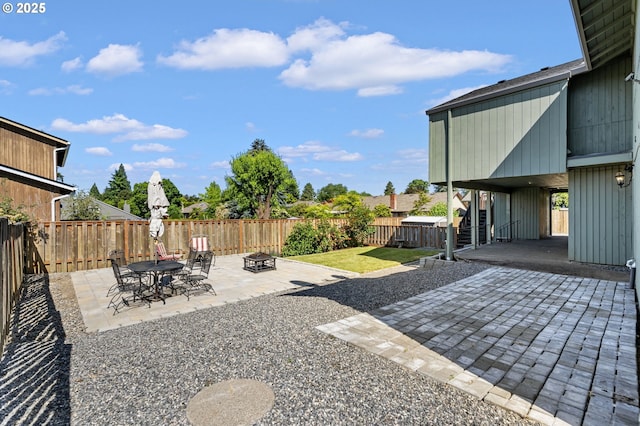 461 NE 16th Ave, Hillsboro, OR 97124 - fenced backyard with a patio and a fire pit