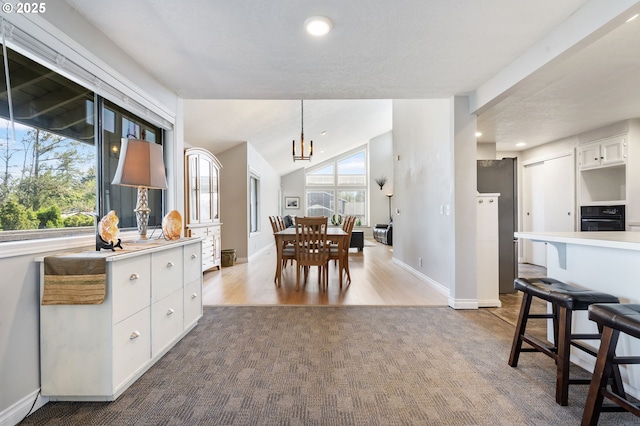 461 NE 16th Ave, Hillsboro, OR 97124 - dining room featuring a chandelier, baseboards, recessed lighting, carpet flooring, and wood finished floors