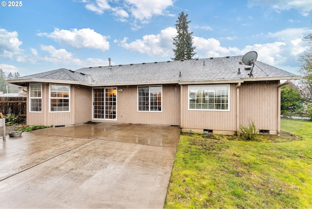 rear view of property with a patio, crawl space, a lawn, and roof with shingles