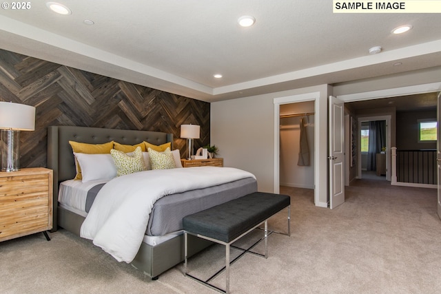 bedroom featuring recessed lighting, baseboards, a closet, carpet, and a walk in closet