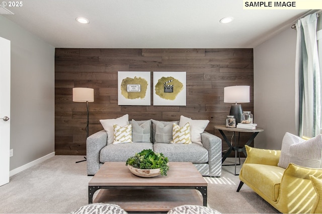 living area with recessed lighting, light carpet, wooden walls, and baseboards