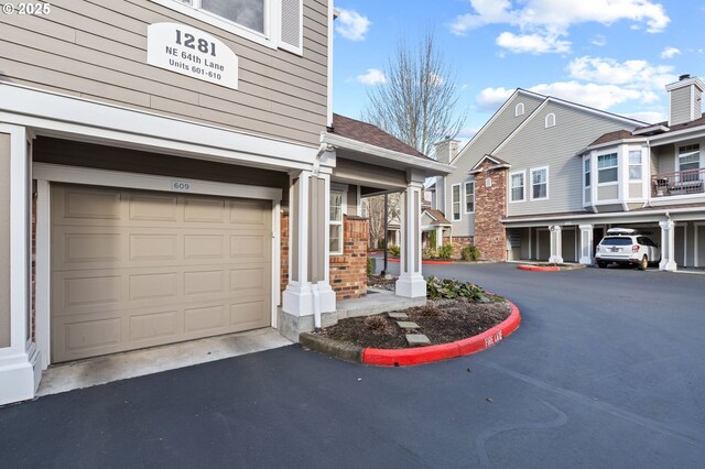 exterior space featuring an attached garage and driveway