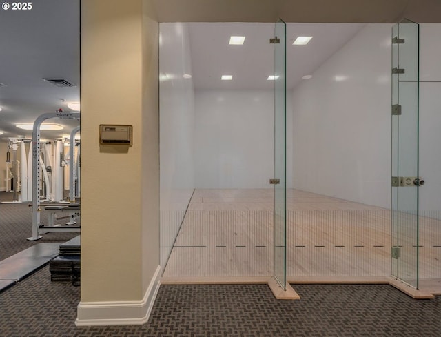 interior space featuring a sport court and visible vents