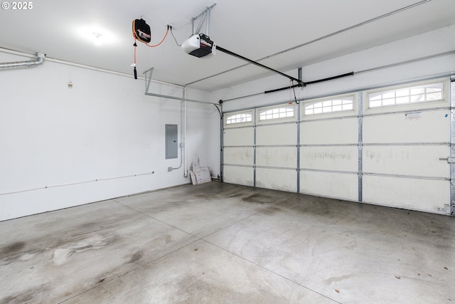 garage featuring electric panel and a garage door opener