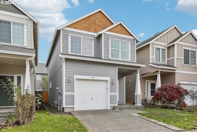 craftsman house featuring a garage and a front yard