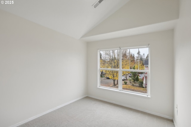 unfurnished room featuring carpet flooring and vaulted ceiling