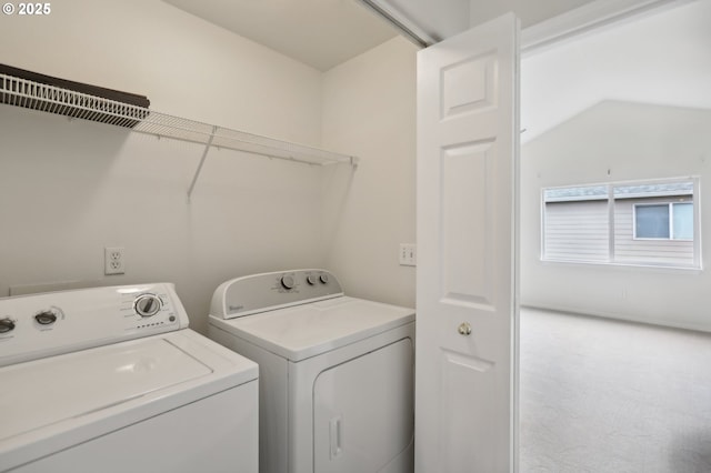 clothes washing area featuring washing machine and dryer