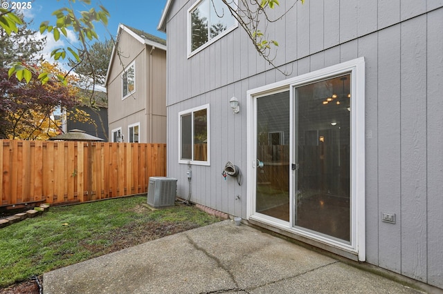 property entrance with a patio and cooling unit