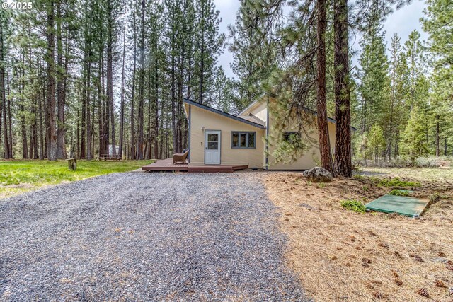 16811 Covina Rd, Bend, OR 97707 - view of front of home featuring a deck and stucco siding