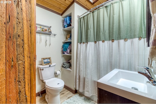 16811 Covina Rd, Bend, OR 97707 - bathroom featuring wood finished floors, vanity, and vaulted ceiling