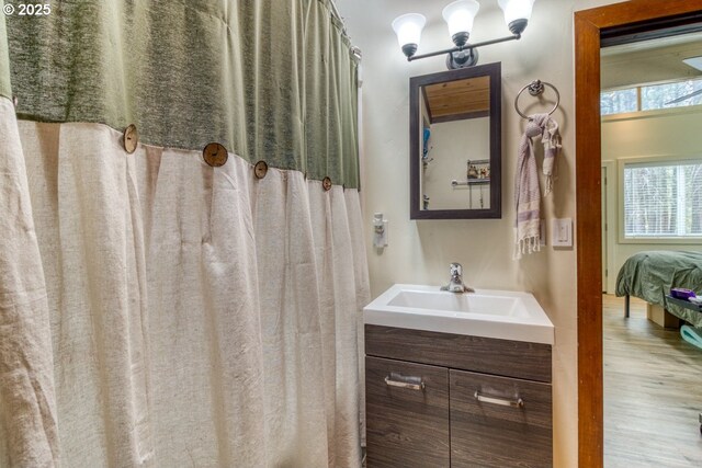 16811 Covina Rd, Bend, OR 97707 - full bathroom with vanity and wood finished floors