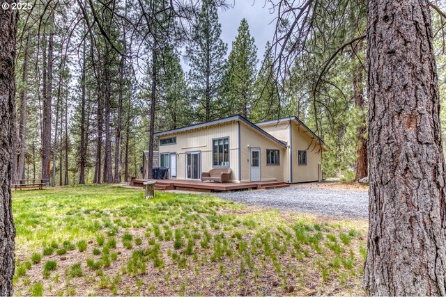 16811 Covina Rd, Bend, OR 97707 - view of front of property with a deck and a front lawn