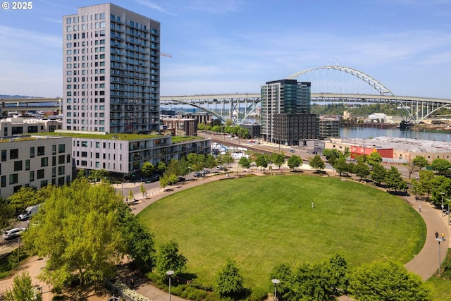 view of urban area with a notable bridge and a large body of water