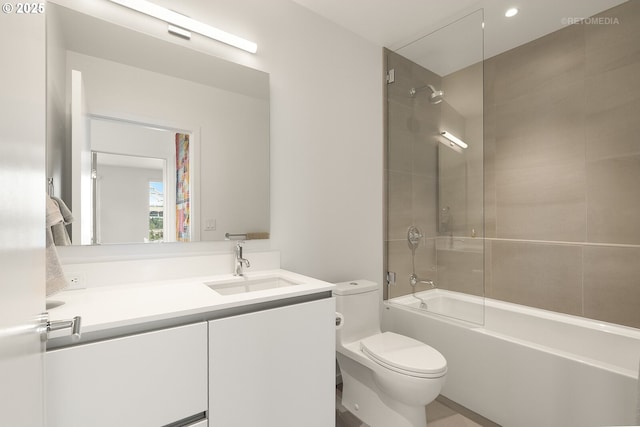 full bathroom featuring toilet, vanity, and shower / bathtub combination