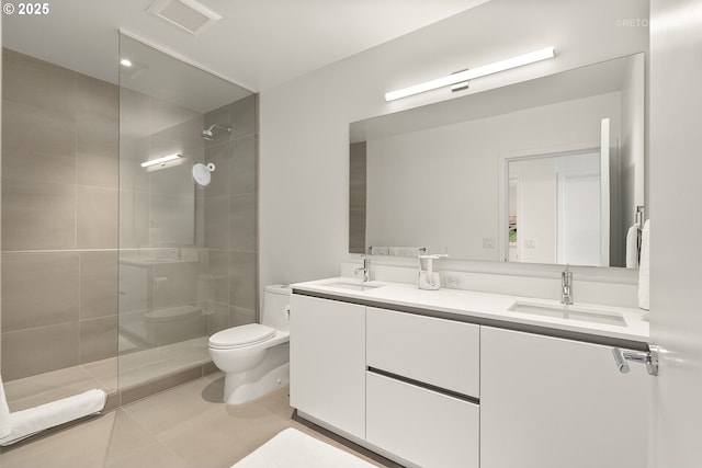 bathroom featuring toilet, walk in shower, double vanity, and tile patterned floors