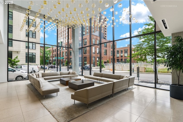 lobby featuring a towering ceiling and floor to ceiling windows