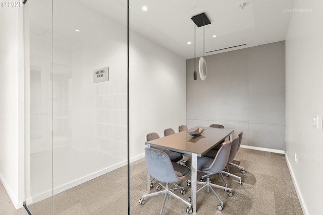 dining space featuring baseboards