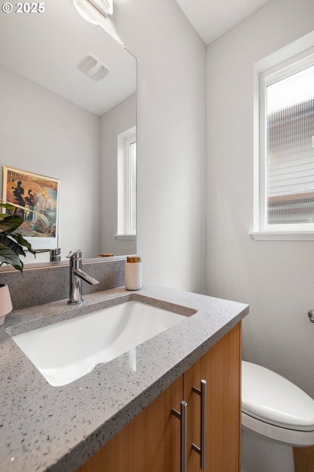 1011 NE 73rd Ave, Portland, OR 97213 - half bathroom with vanity and healthy amount of natural light