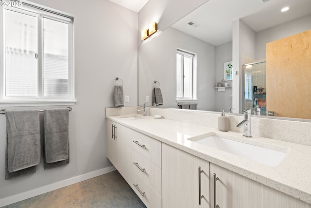 1011 NE 73rd Ave, Portland, OR 97213 - bathroom with a shower stall, double vanity, and finished concrete floors