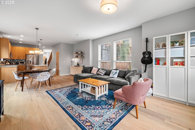 1011 NE 73rd Ave, Portland, OR 97213 - living room with light wood-style flooring, recessed lighting, and a chandelier