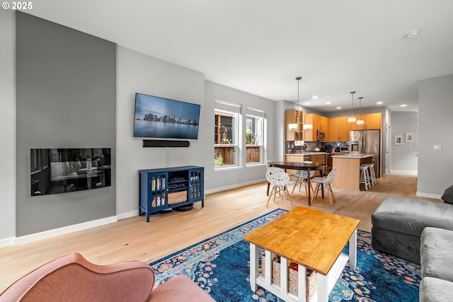1011 NE 73rd Ave, Portland, OR 97213 - living room featuring recessed lighting and light wood-style flooring