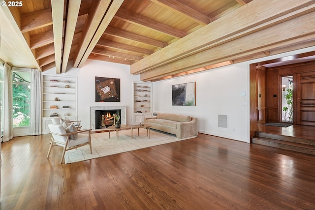 6151 SW Mill St, Portland, OR 97221 - living area with wood finished floors, wood ceiling, a warm lit fireplace, and built in features