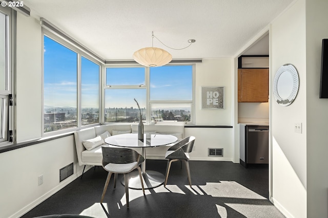 dining area featuring baseboards and visible vents