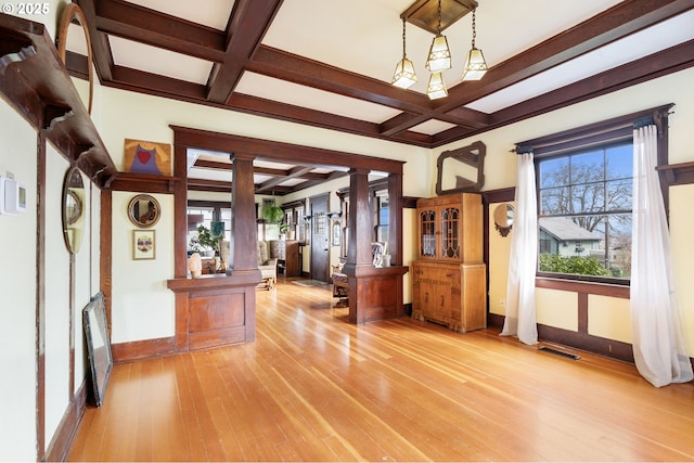 155 S 8th St, Saint Helens, OR 97051 - living area featuring a fireplace with flush hearth, beamed ceiling, coffered ceiling, and wood finished floors