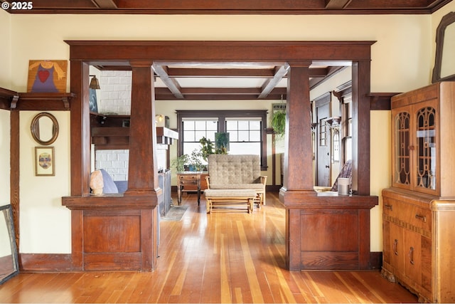 155 S 8th St, Saint Helens, OR 97051 - interior space featuring baseboards, beamed ceiling, coffered ceiling, ornate columns, and hardwood / wood-style floors