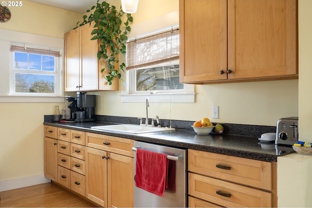 155 S 8th St, Saint Helens, OR 97051 - kitchen featuring dark countertops, light wood-type flooring, dishwasher, a sink, and light brown cabinets