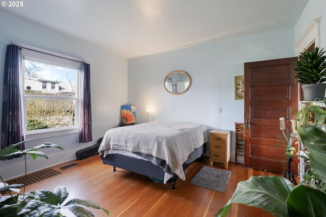 155 S 8th St, Saint Helens, OR 97051 - kitchen with visible vents, appliances with stainless steel finishes, baseboards, light wood-style floors, and under cabinet range hood