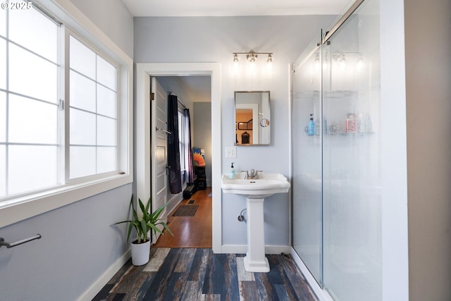 155 S 8th St, Saint Helens, OR 97051 - bathroom featuring a shower stall, wood finished floors, a sink, baseboards, and toilet