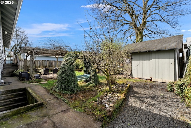 155 S 8th St, Saint Helens, OR 97051 - view of yard with an outbuilding, stairway, fence, a storage unit, and a patio